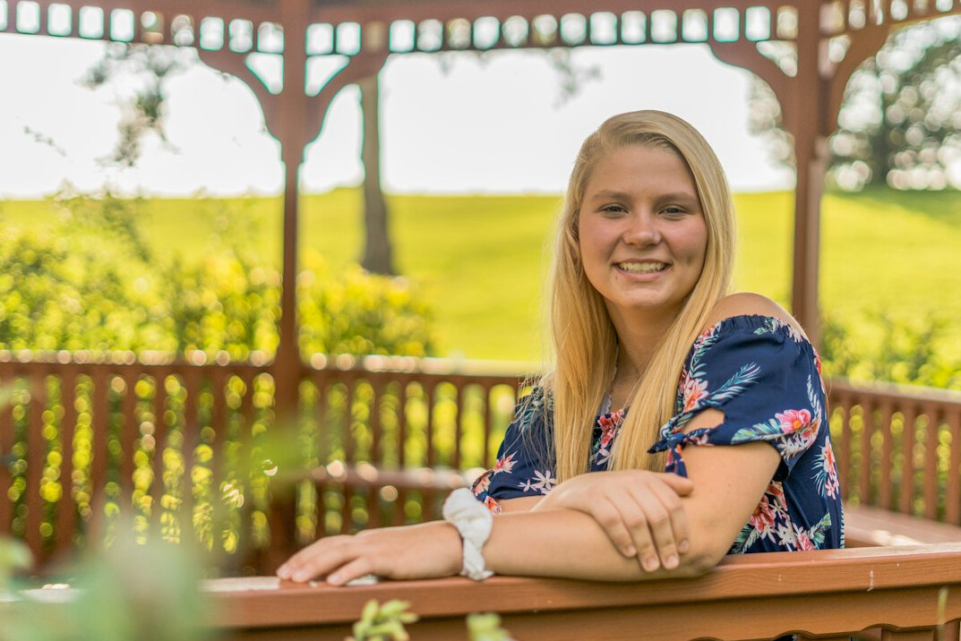 Portrait of a woman with blonde hair smiling