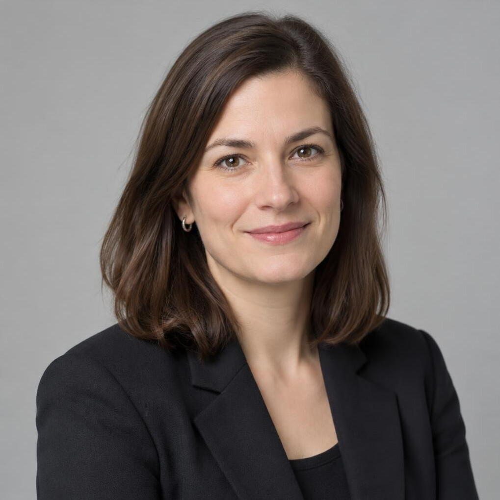 Portrait of a professional woman with long hair in a blazer