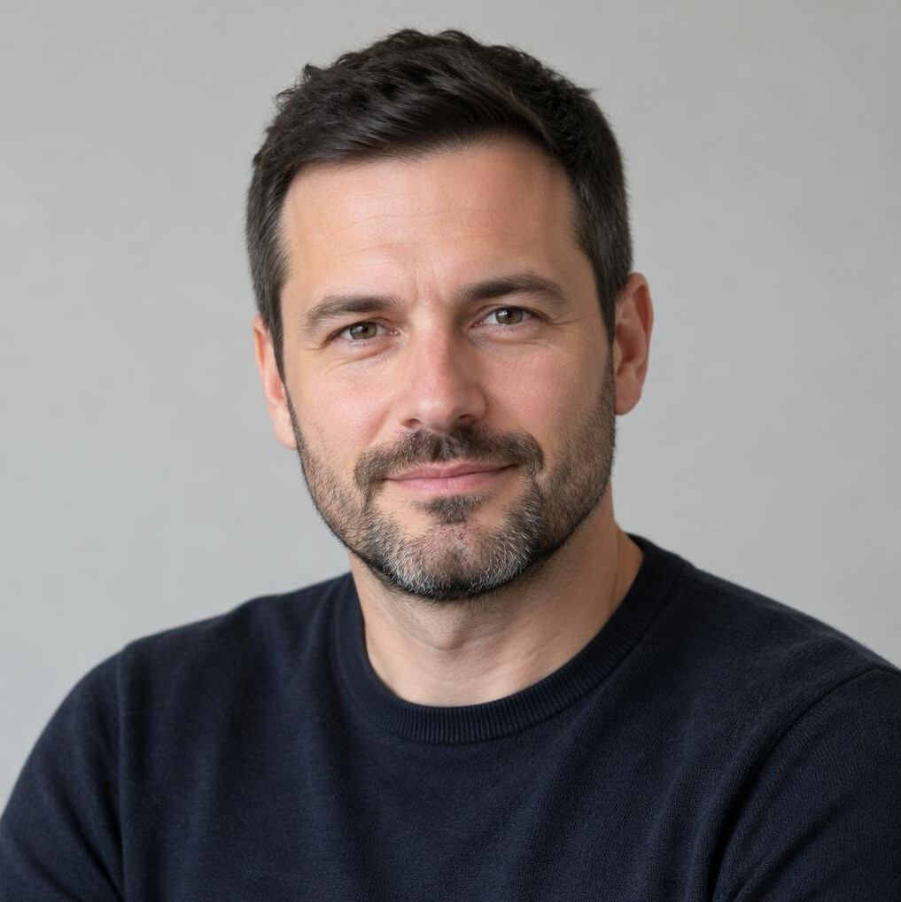 Portrait of a man with a beard looking at the camera